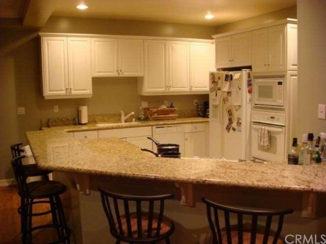 Almost endless granite counters and breakfast bar 