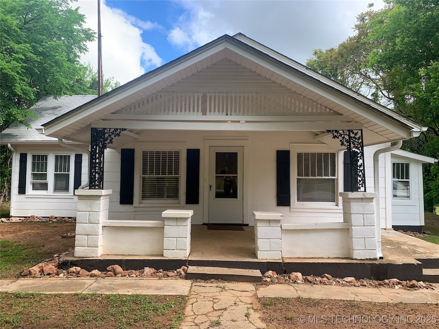 View of front of house featuring a shingled roof