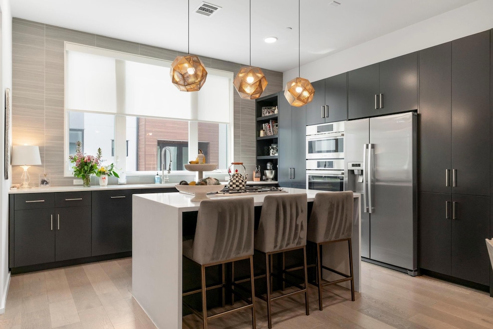 Kitchen with stainless steel appliances, a sink, 