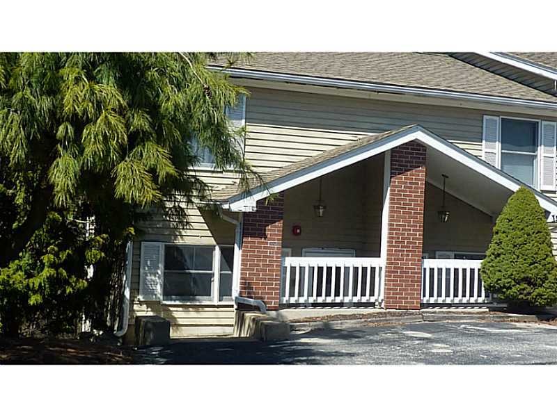 Exterior Front. End Unit one bedroom condominium
