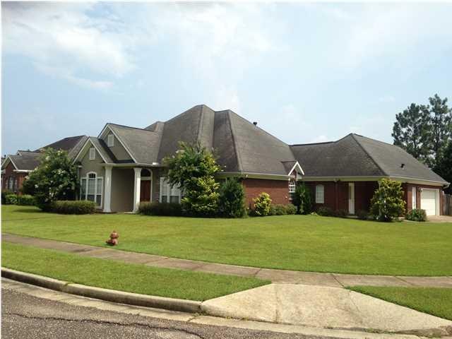 front- large privacy fenced corner lot