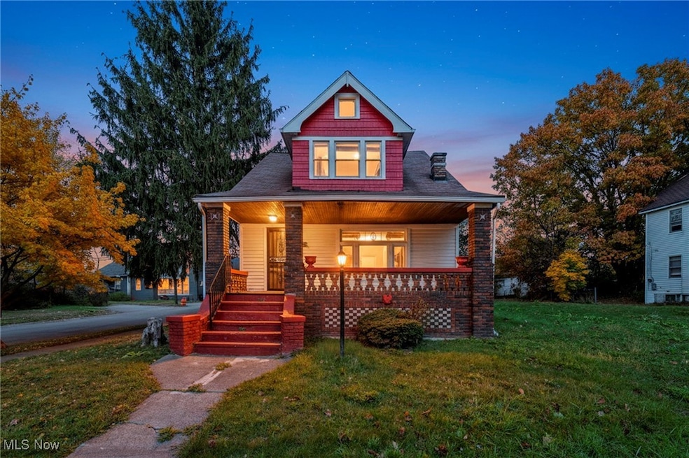 Bungalow-style house featuring a yard and a porch