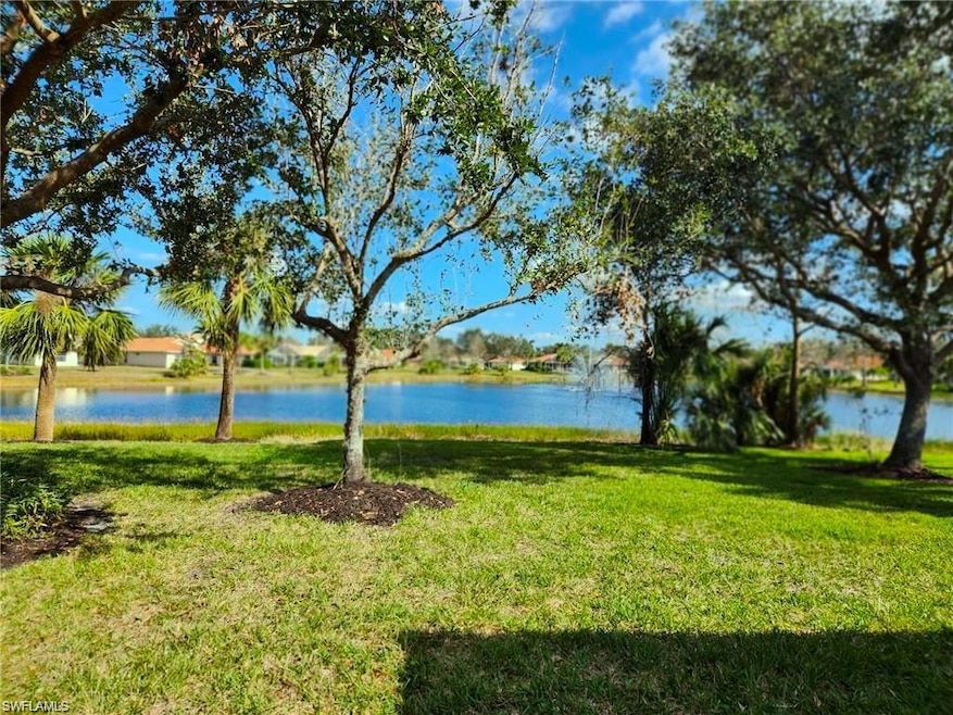 View of green lawn with a water view