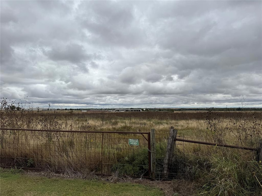 View of yard with a rural view