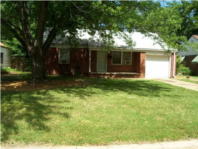Nice home, front porch and Maple tree!