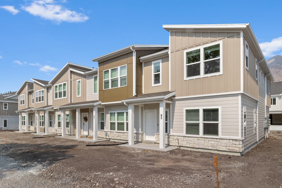 View of front of property with stone siding, board and batten siding, and a residential view