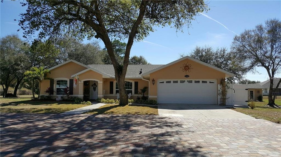 Beautifully paved driveway leading to this Gorgeous 3/2/2 Pool Home......