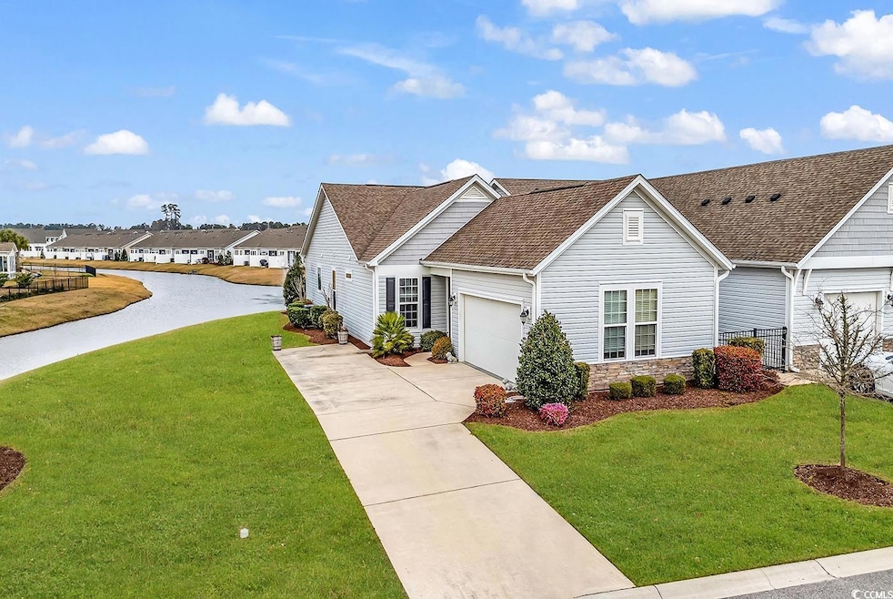 View of front of property with stone siding, an at