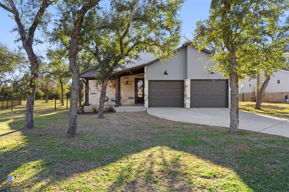View of front of property with a garage, concrete