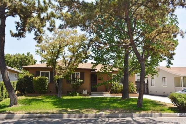 great curb appeal with well groomed trees