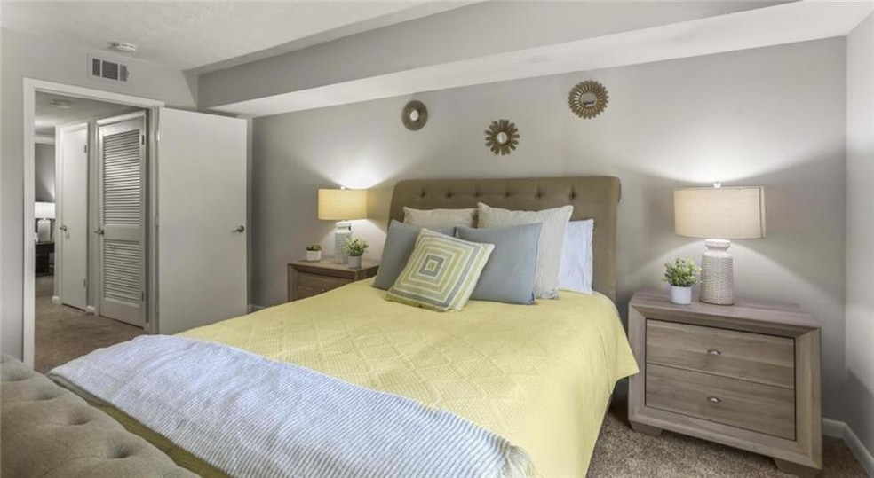 View of carpeted bedroom