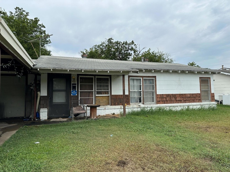 Single story home featuring a front yard