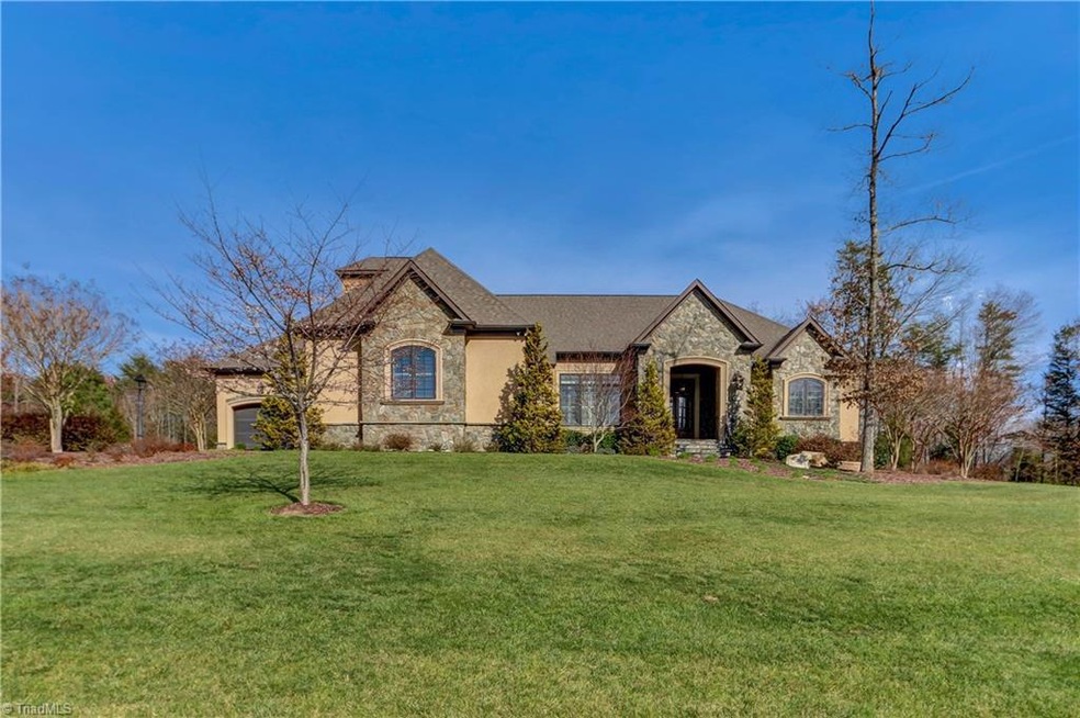 This former Holiday Showcase of Homes will delight!  Situated on 2.79 acres, this masonry framed and Energy Star rated home provides both luxury & privacy with convenient access to airport, shopping and trails.  And, rare to find, 4 spacious bedrooms on the main level.  Custom details and built-ins throughout.