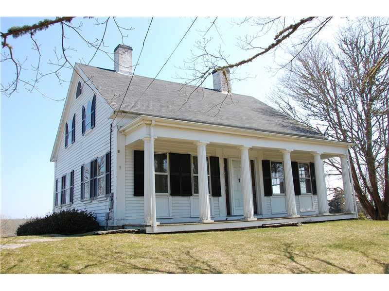 Exterior Front. Classic Greek Revival style with R