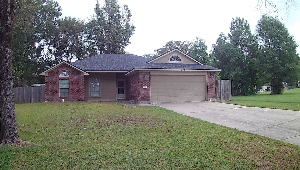 Ranch-style house with brick siding, concrete driveway, an attached garage, and a shingled roof