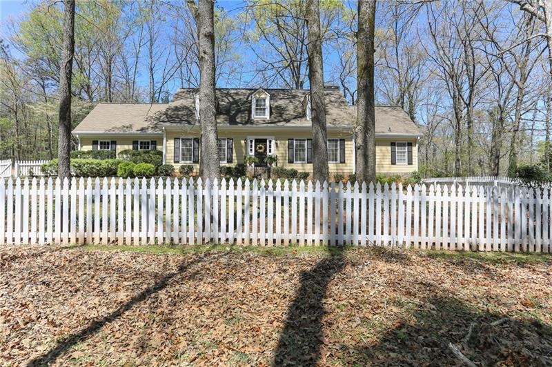 Perfect setting on this private corner lot in John