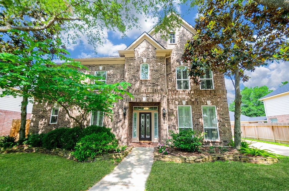 If you're looking for a home that stands out from the rest, you've found it! Begin your journey through the home with a beautiful entrance surrounded by an impressive landscape.