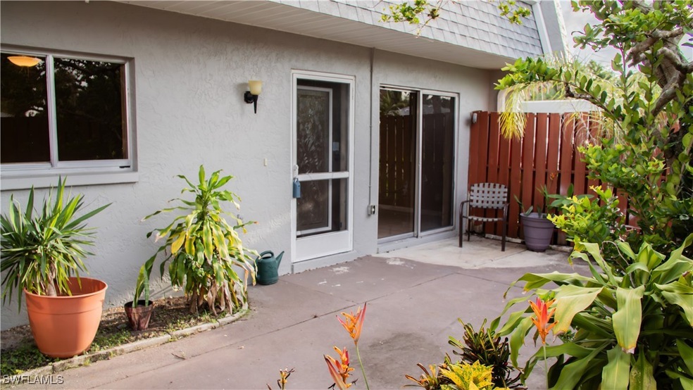 View of exterior entry with a patio