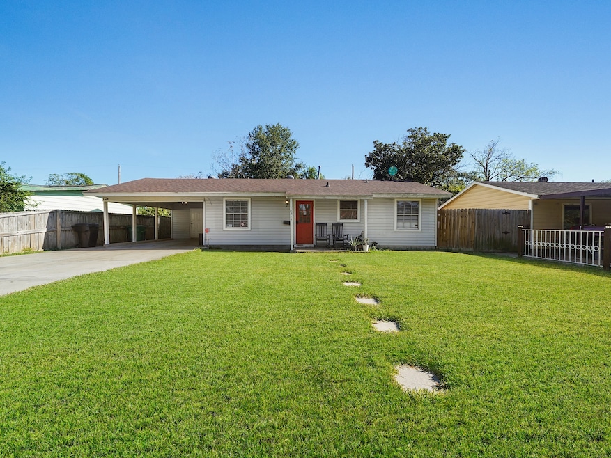 Double wide drive way with attached carport.