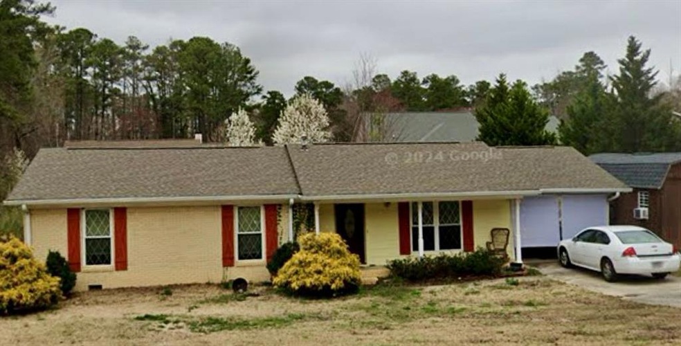 Ranch-style house featuring a garage