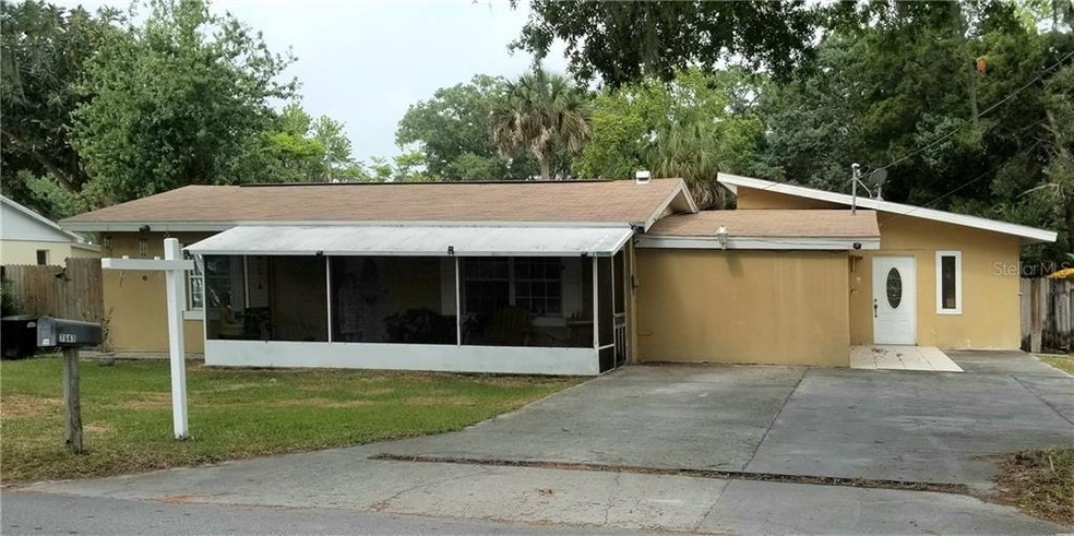 Front view of home with screened in porch