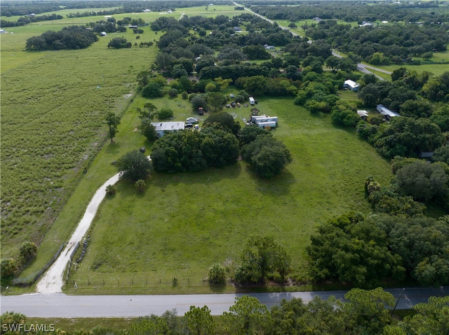 Birds eye view of property featuring a rural view
