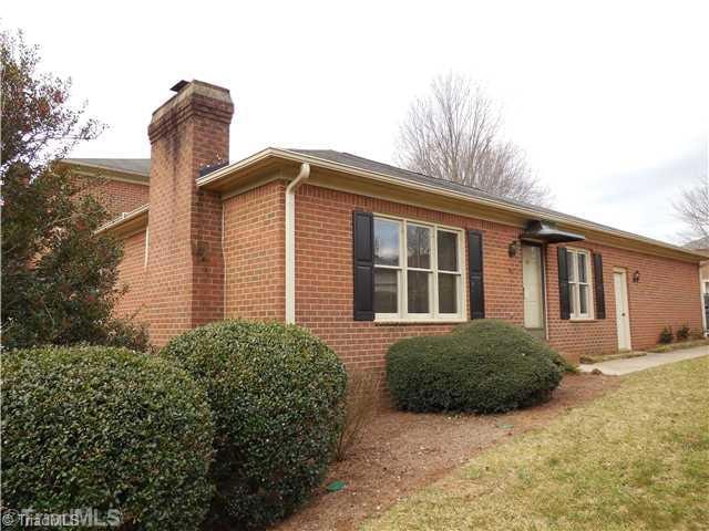 Facade/Exterior Front. Rare 1-Level Brick Townhome in Sherwood Forest with Attached Garage