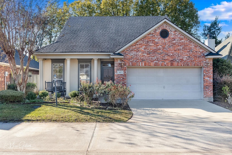 View of property with a garage