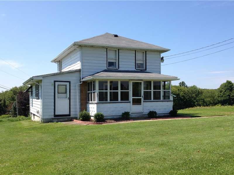 Exterior Front. Situated on a corner lot, with enc