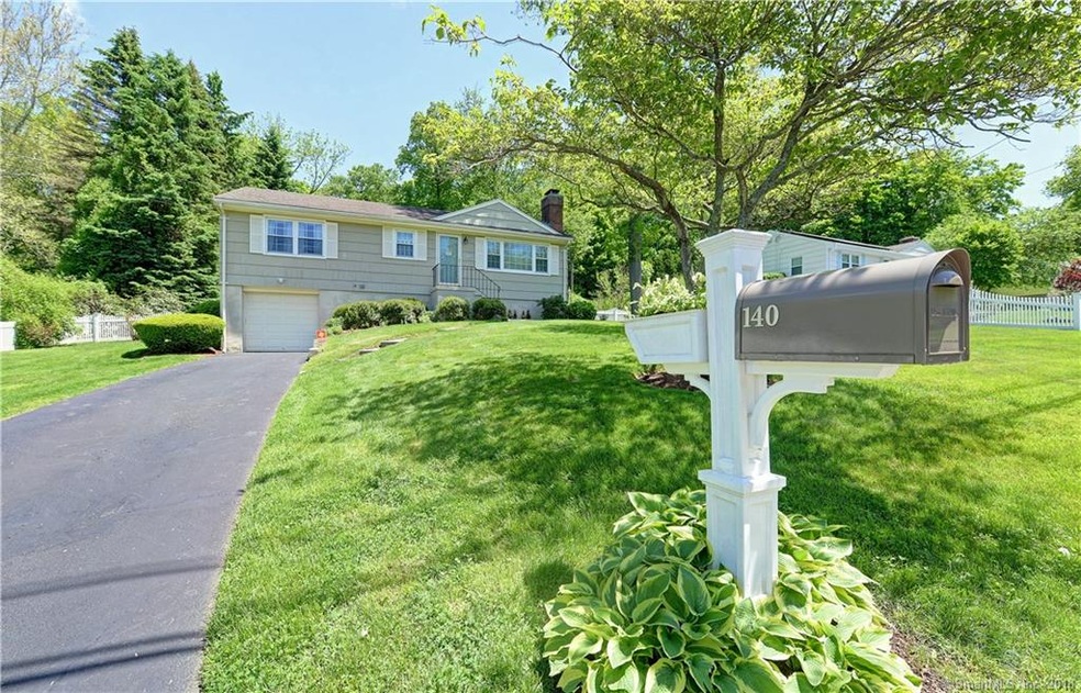 The driveway leading to the attached garage.