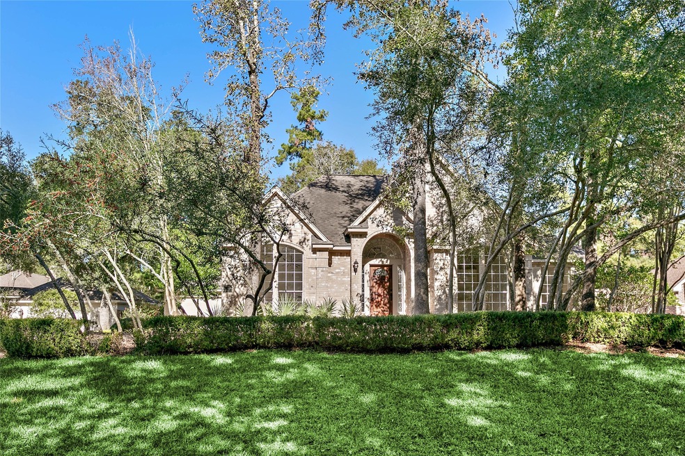 Welcome home to 38 E Sunny Slope in The Woodlands!