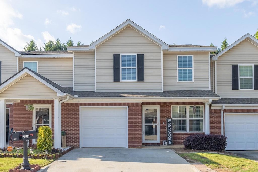 Townhome / multi-family property with brick siding