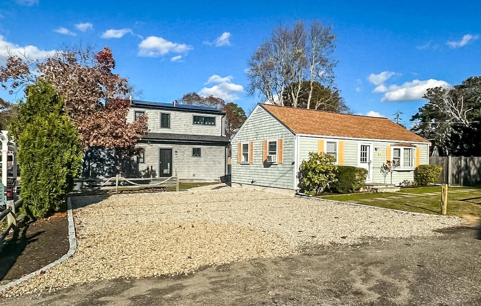Unit 1 - Front angle with stone driveway