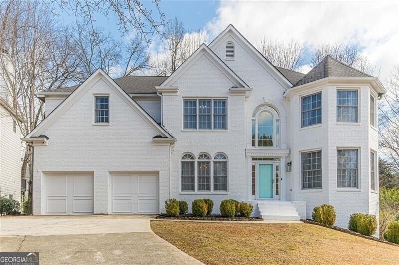 View of front of property with a front lawn and a 