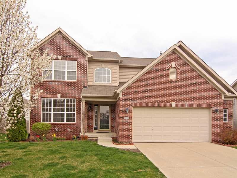 Exterior Front. Wow - this home is almost all brick on the front!  Such a great first impression!  Flowering tree is in bloom!  Nice 4  extension on the garage for extra storage space. Come join this great community!!!