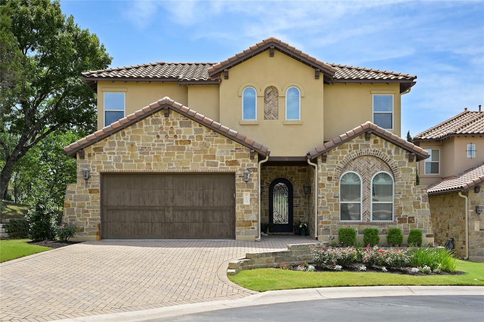 Mediterranean / spanish house featuring stone sid