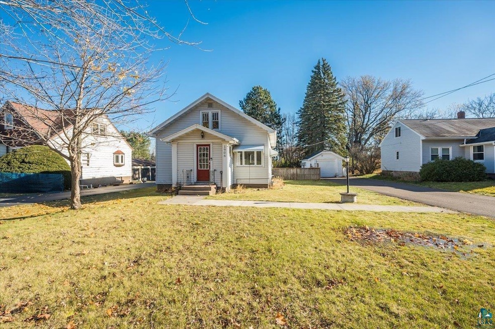 Bungalow-style house featuring a front yard, an ou