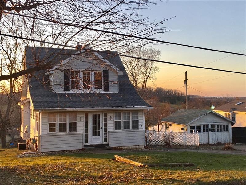 Charming Cape Cod with level yard.