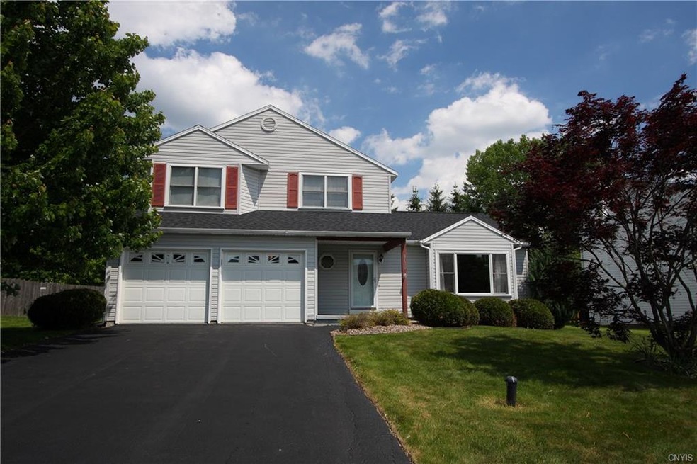 Welcome to 8170 Rizzo Drive!  The 2 car garage has