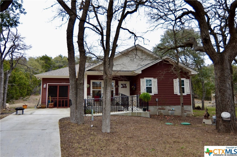 Welcome home to this adorable cottage with beautiful custom wrought iron railing!