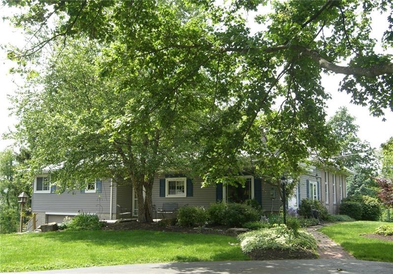 Picture perfect setting with mature trees and lush