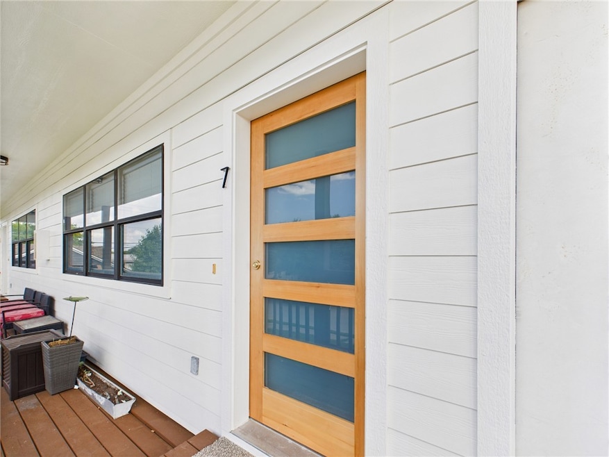 Property entrance featuring covered porch