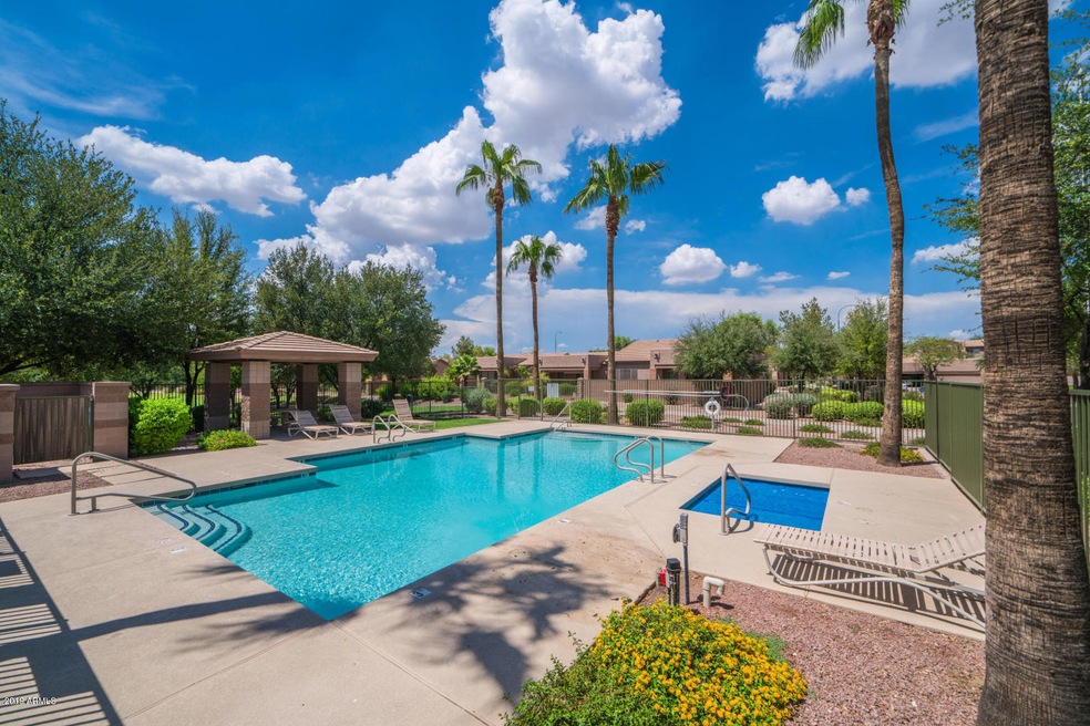 community pool area with cabana and hot