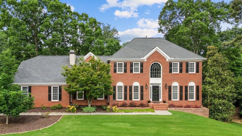 Welcome to this elegant brick-front home with side entry garage and landscaped yard.