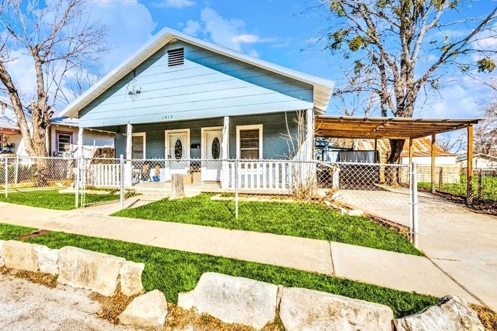 View of front of property with covered porch and a