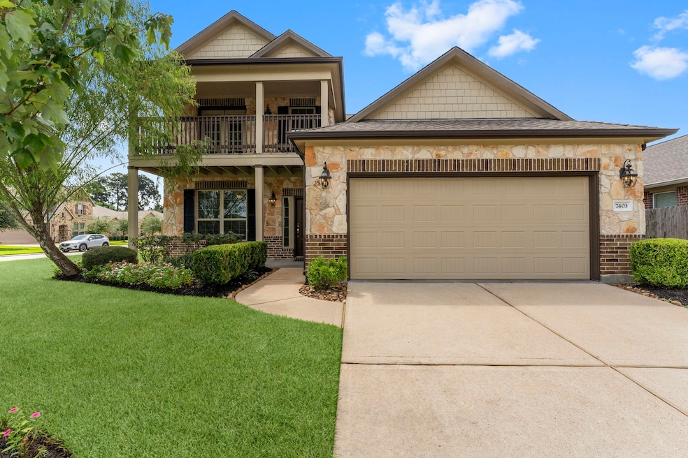 Charming two-story home features a stone and brick
