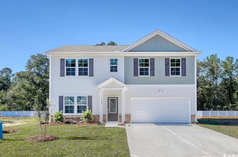 View of front of house featuring a garage and a fr