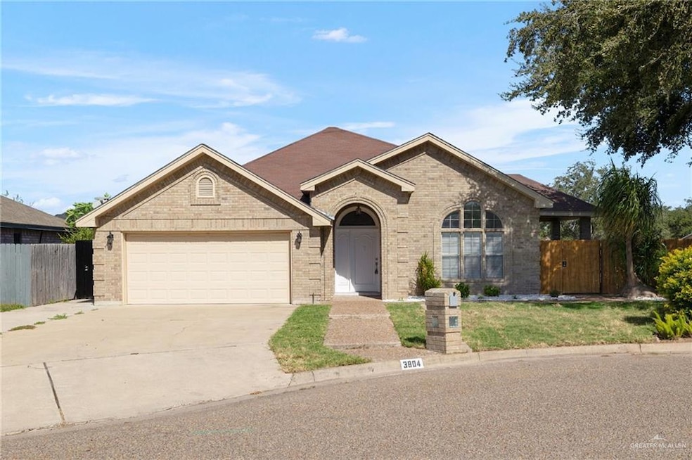 Single story home featuring brick siding, concrete driveway, and an attached garage