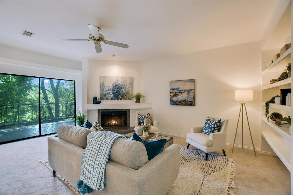 Living room featuring visible vents, carpet floor