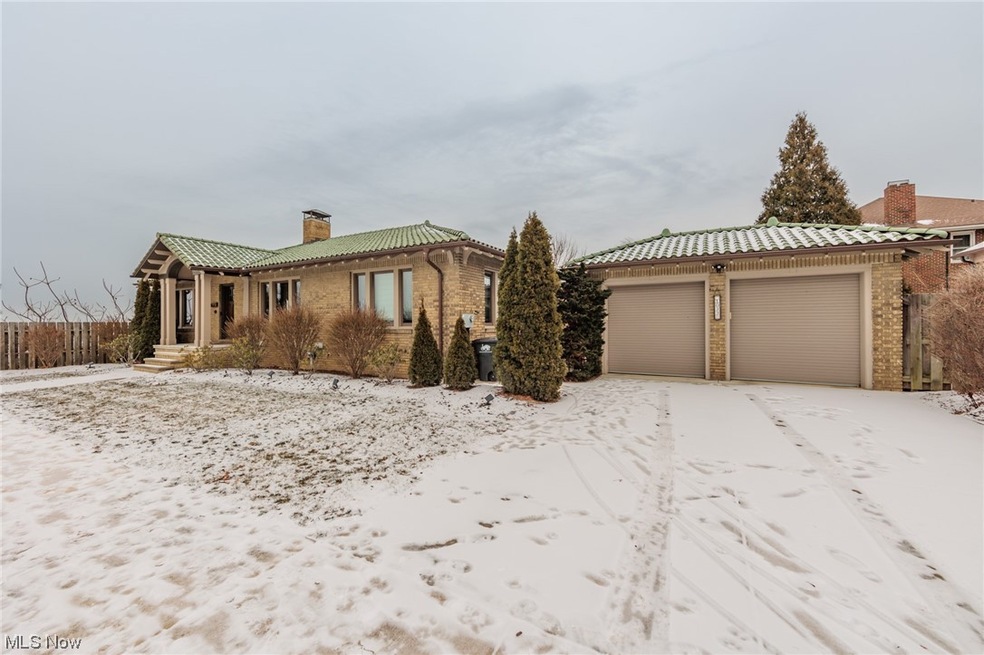View of front facade featuring a garage